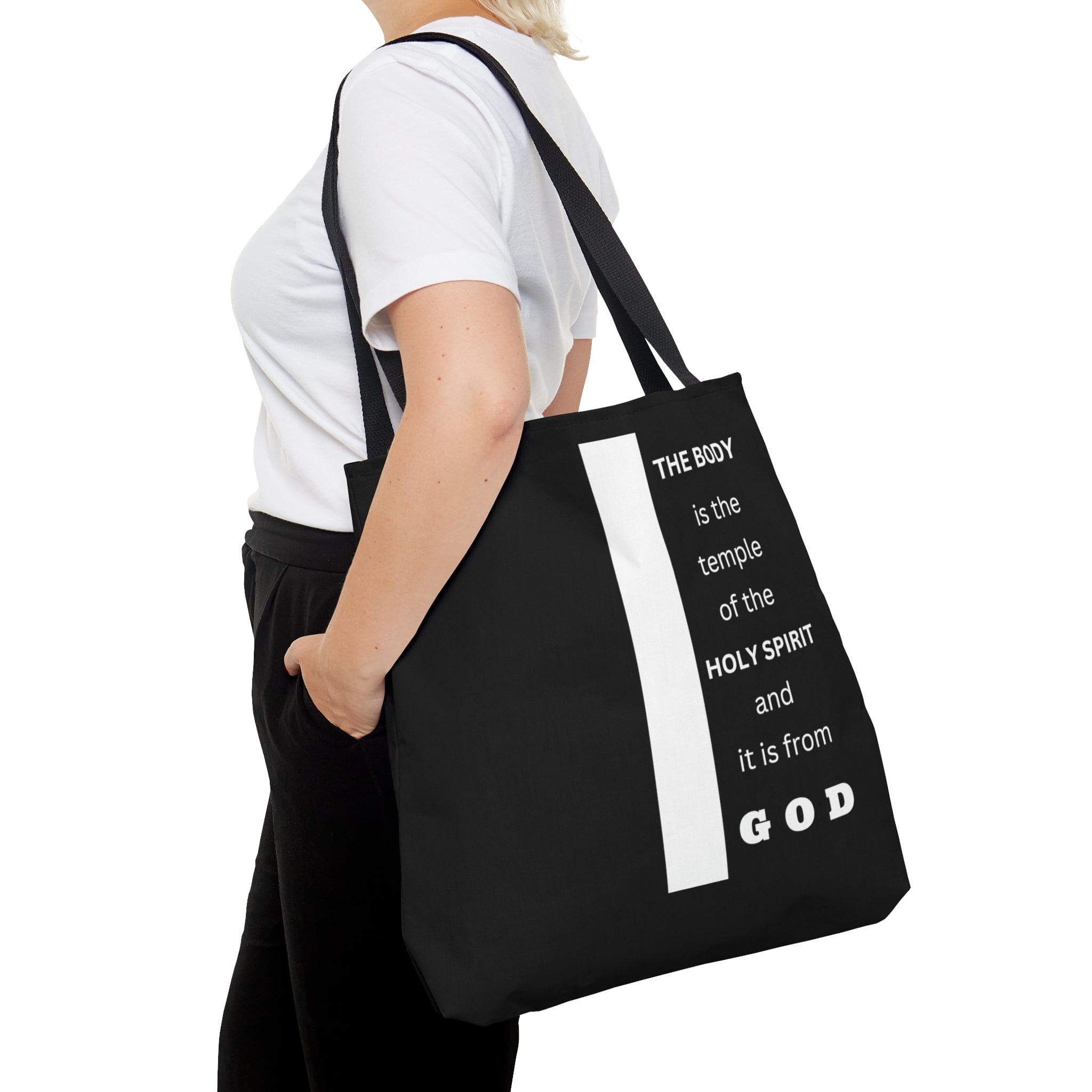 Canvas Tote Bag with scripture 'The Body is the Temple of the Holy Spirit', featuring a stylish all-over print and black cotton handles.