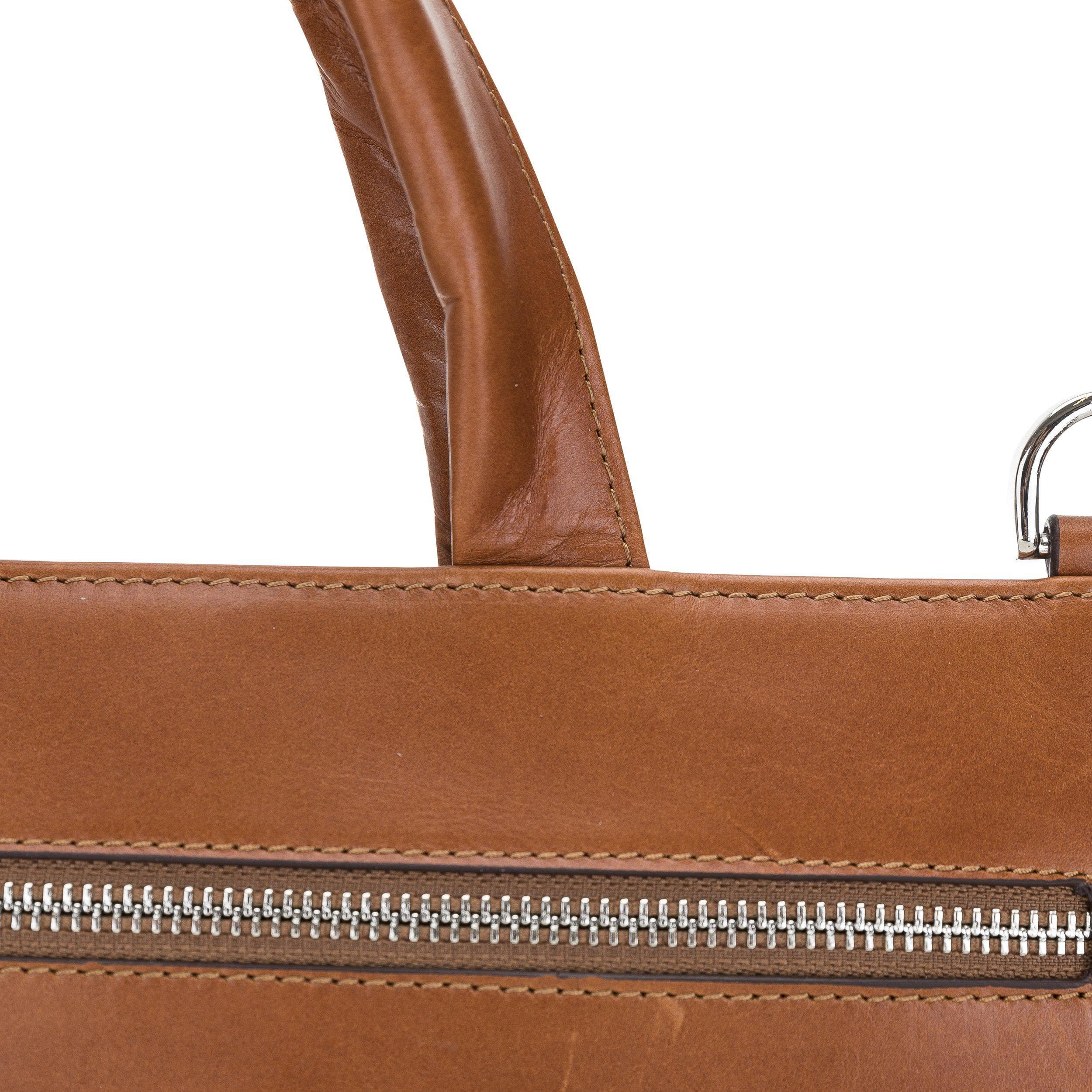 Canzo Leather Notebook Bag made from 100% genuine calf leather, featuring a zippered main compartment and adjustable shoulder straps.