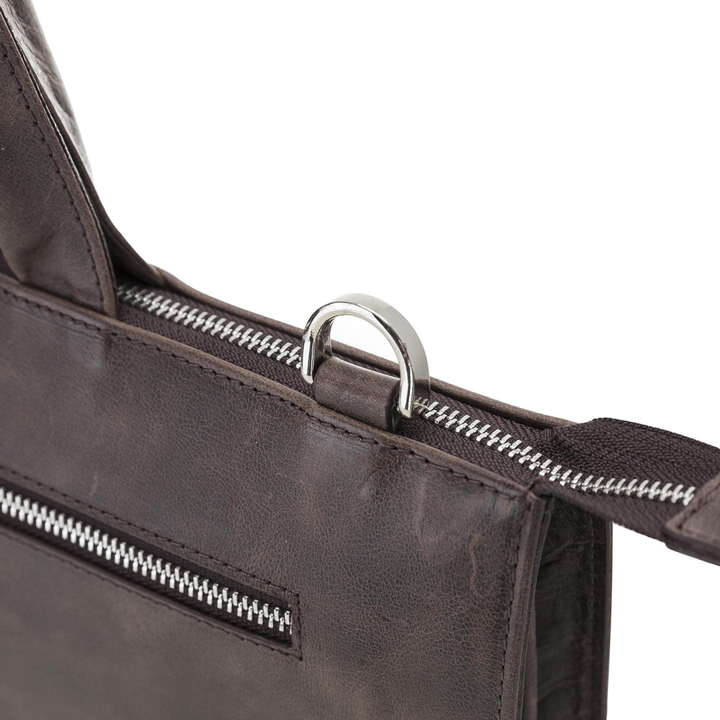 Canzo Leather Notebook Bag made from 100% genuine calf leather, featuring a zippered main compartment and adjustable shoulder straps.