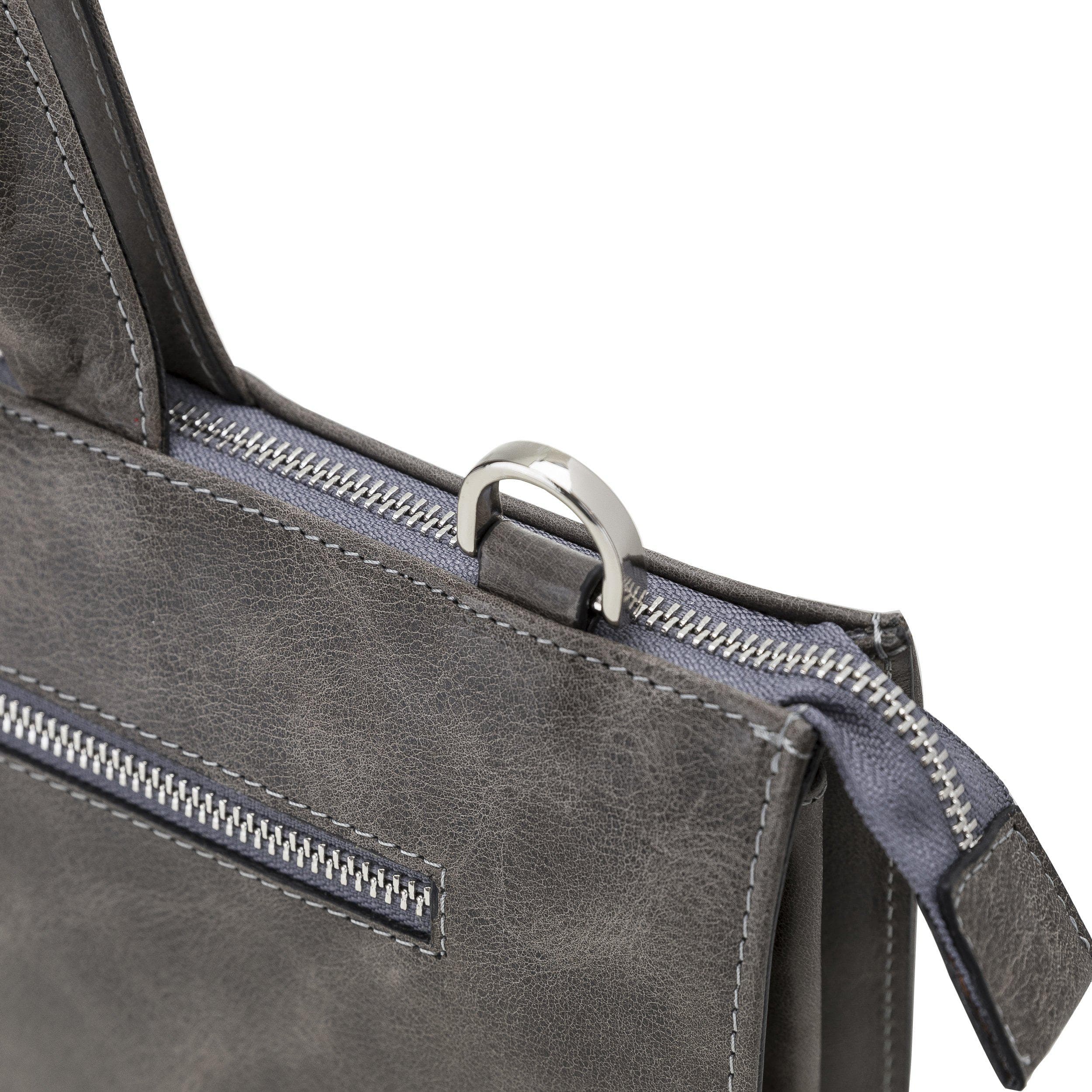 Canzo Leather Notebook Bag made from 100% genuine calf leather, featuring a zippered main compartment and adjustable shoulder straps.