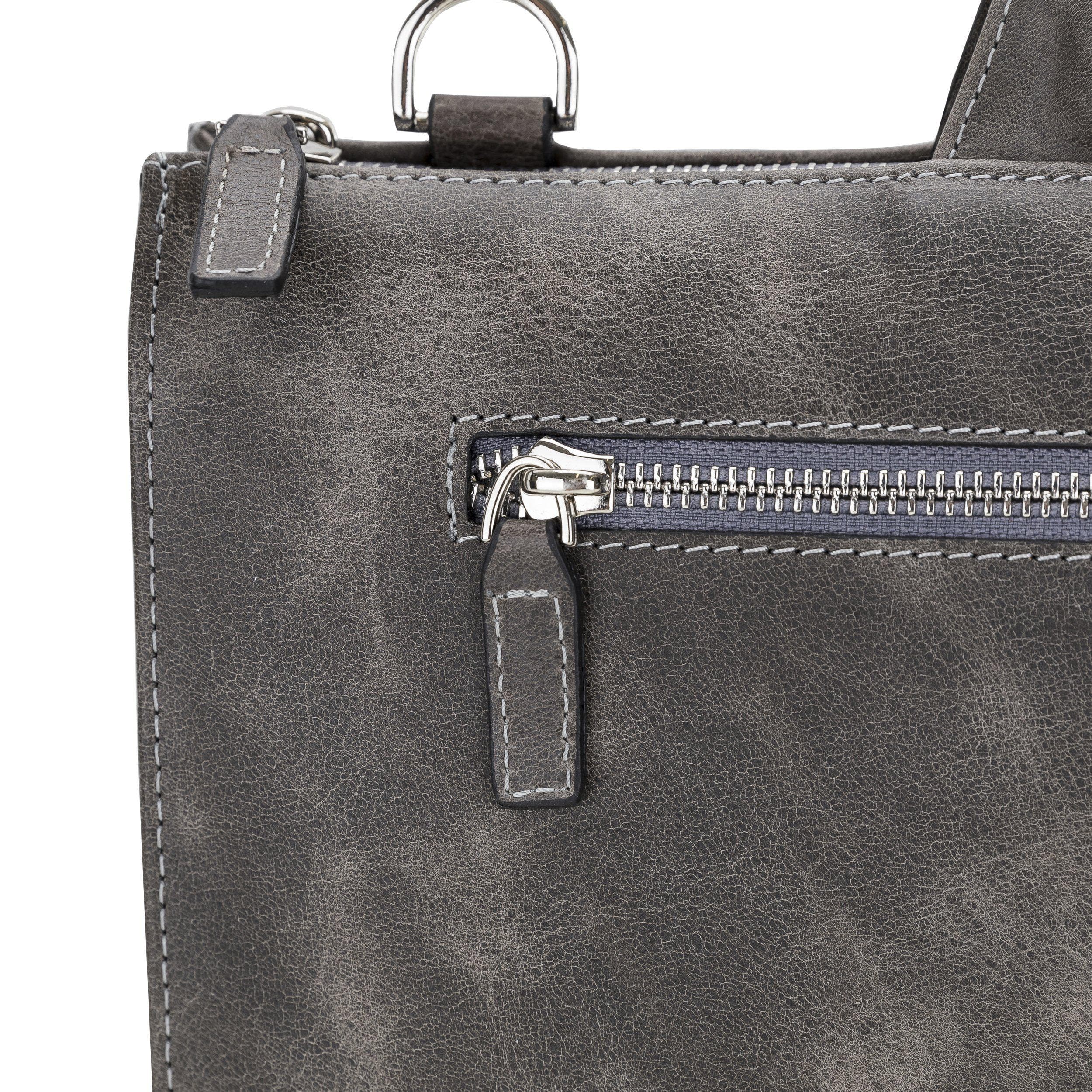 Canzo Leather Notebook Bag made from 100% genuine calf leather, featuring a zippered main compartment and adjustable shoulder straps.