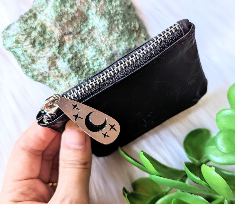 Celestial Magic Coin Purse made of embossed vegan leather with a silver-tone zipper featuring a celestial design.