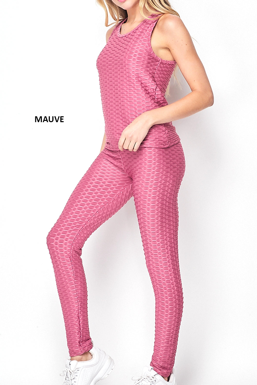 A stylish two-piece set featuring Cellulite Hiding Leggings and a matching tank top, designed for comfort and style.