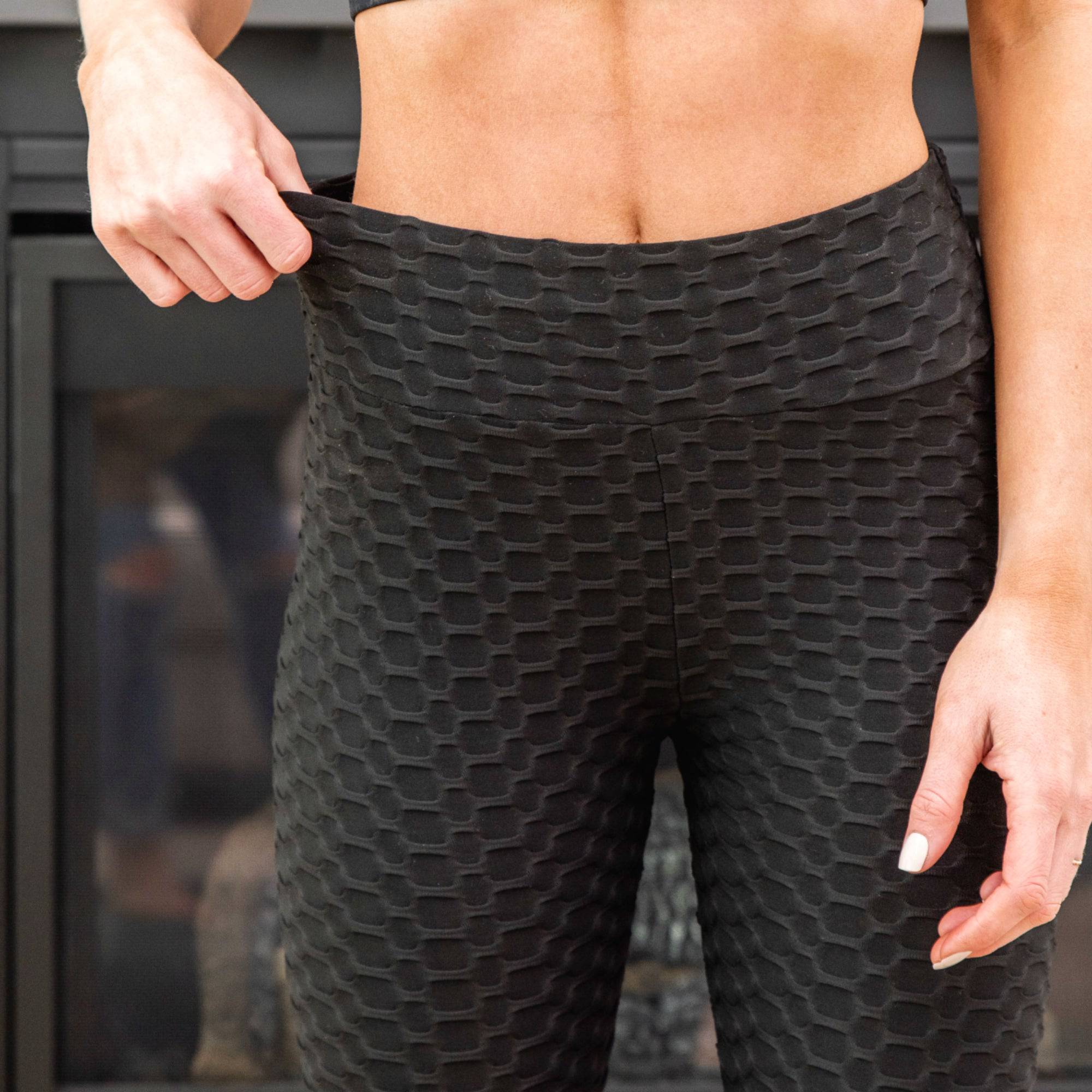 A pair of stylish Cellulite Hiding Leggings in a textured fabric, designed for comfort and coverage, showcasing their long length and flattering fit.