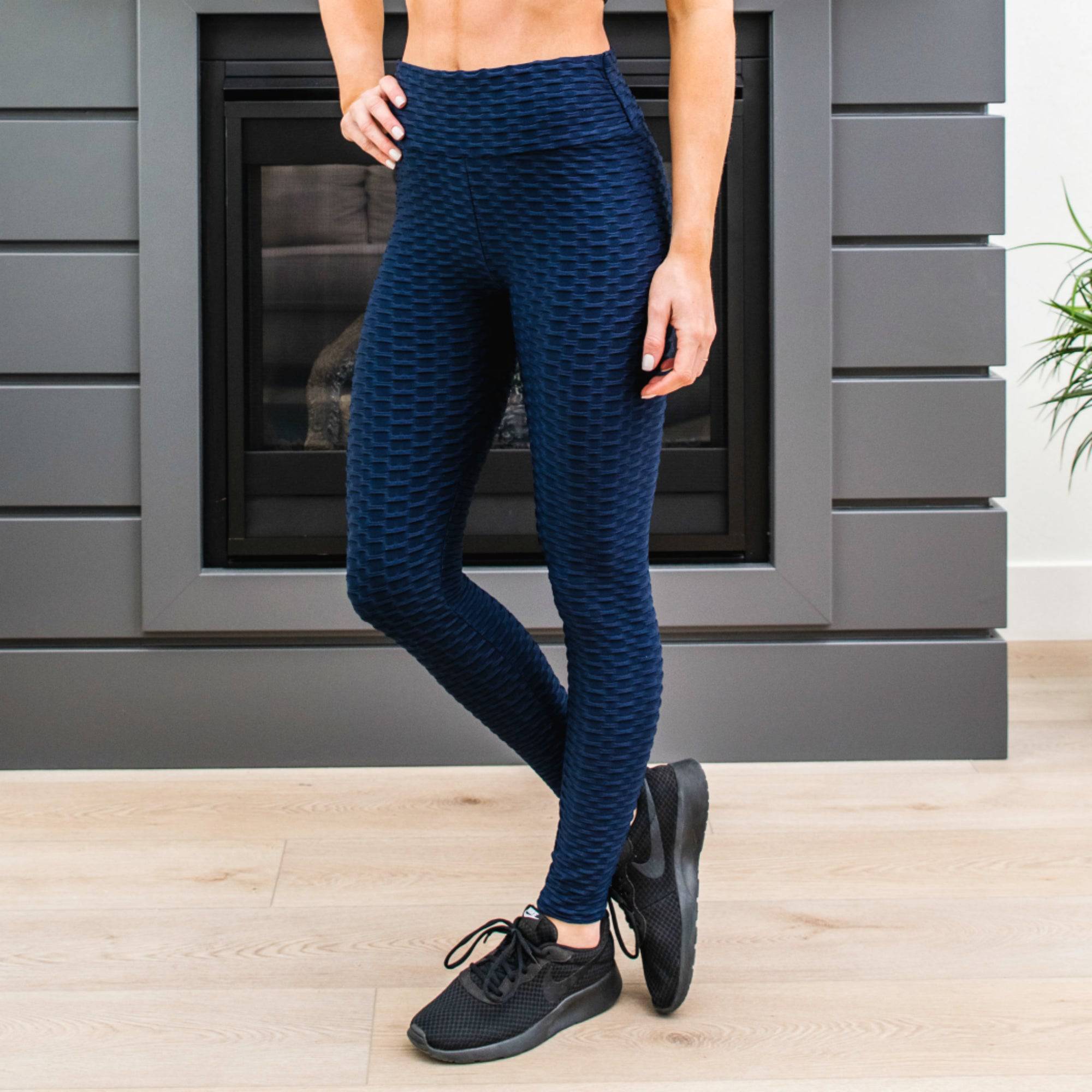 A pair of stylish Cellulite Hiding Leggings in a textured fabric, designed for comfort and coverage, showcasing their long length and flattering fit.