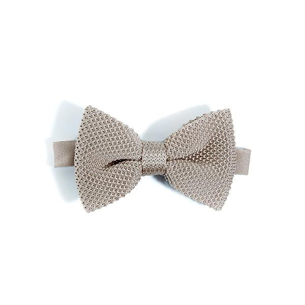 Champagne knitted bow tie showcasing its elegant design and soft texture.