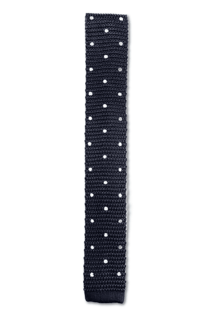 Charcoal knitted tie with white polka dots, showcasing a luxurious silk texture and square end design.