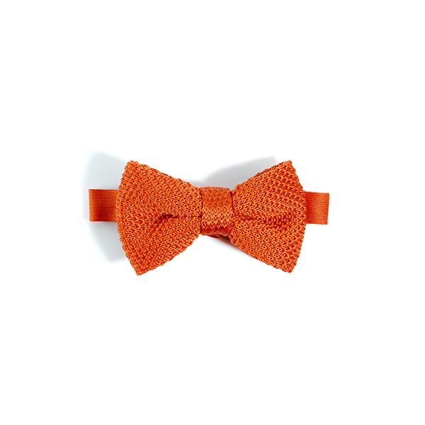 Children's burnt orange knitted bow tie, made of polyester, suitable for ages 2-11, featuring a stylish design.