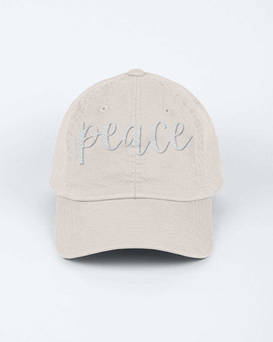 Chino Cap featuring a peace embroidered graphic, made from 100% chino cotton twill, showcasing a low-profile design.