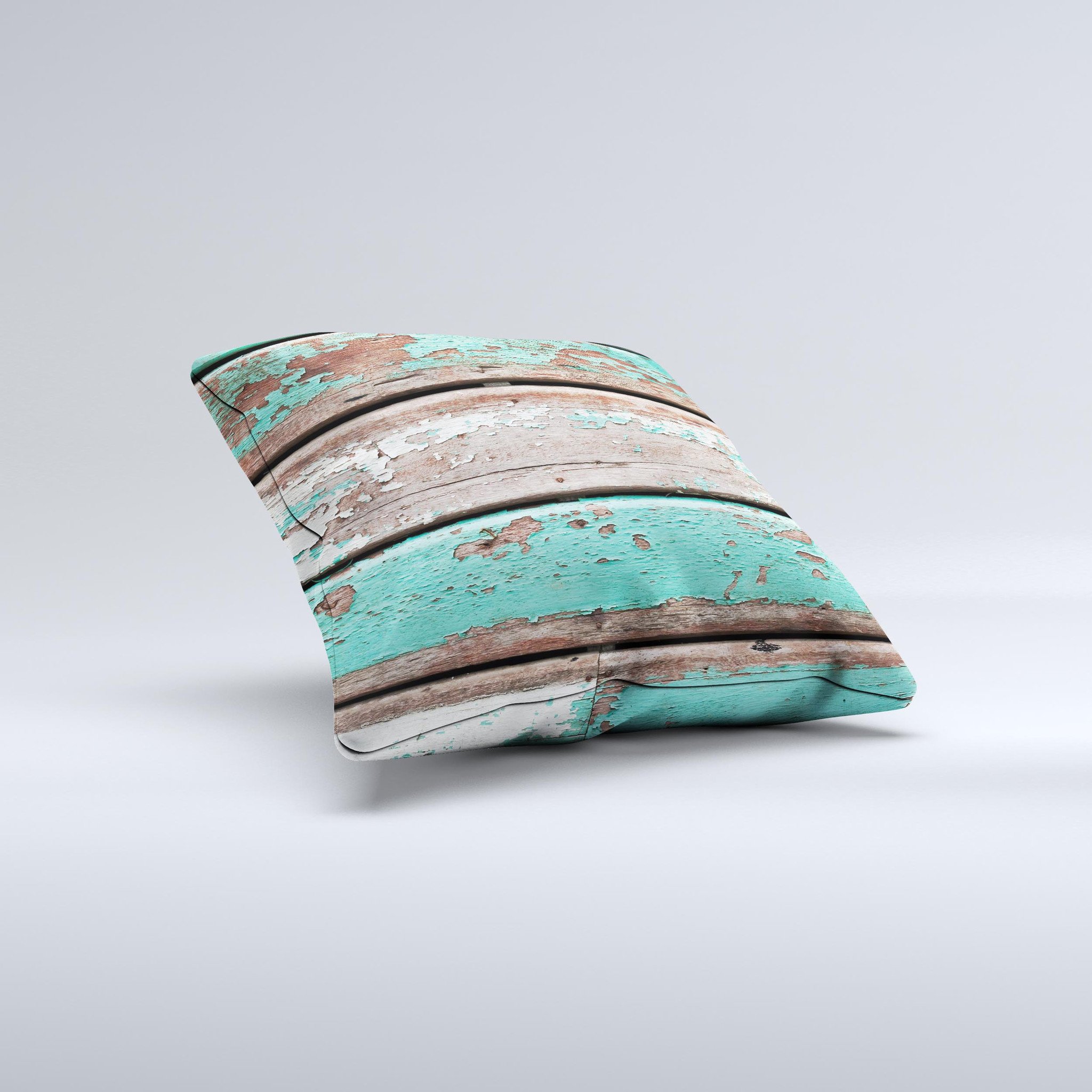 Chipped teal paint on wood decorative throw pillow, handcrafted with high thread count fabric and unique design.