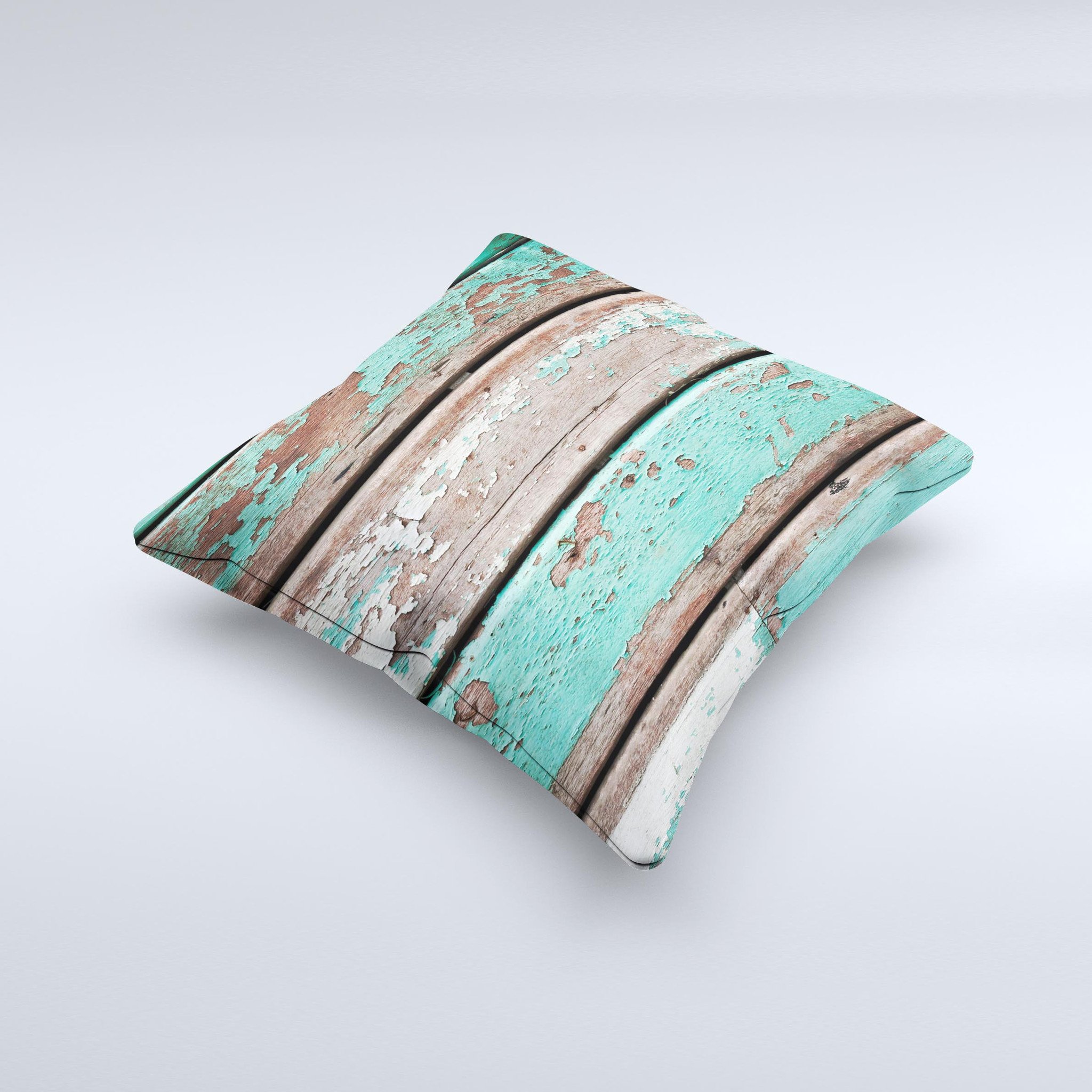 Chipped teal paint on wood decorative throw pillow, handcrafted with high thread count fabric and unique design.