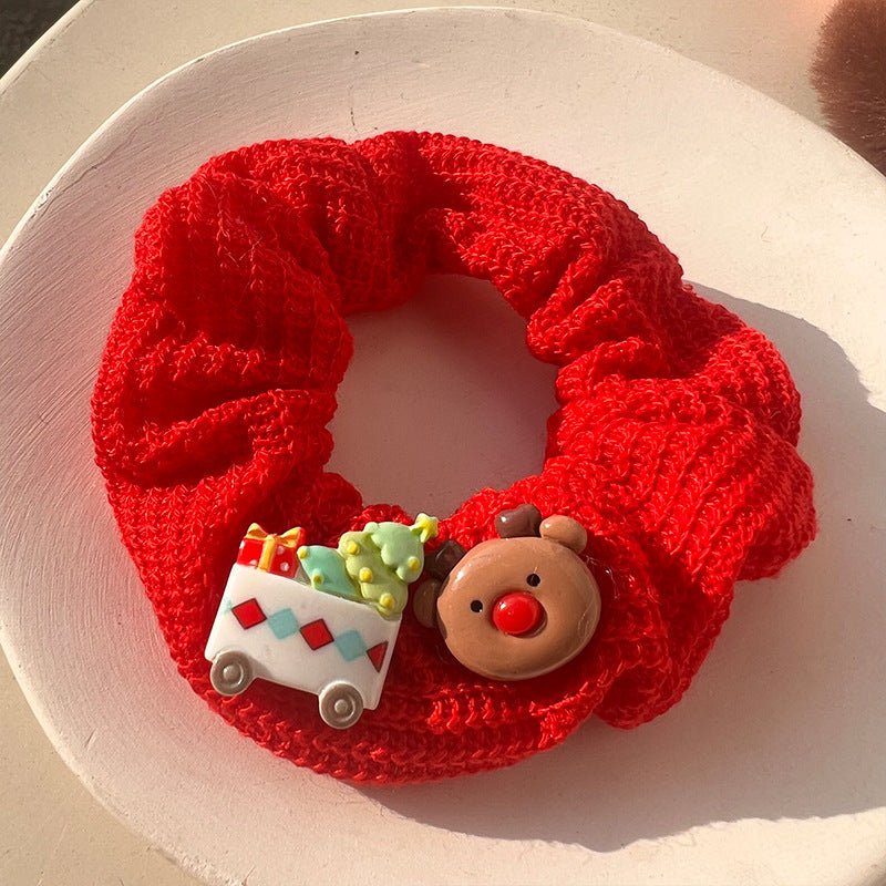 A luxurious Christmas Red Velvet Hair Tie, perfect for festive hairstyles, showcasing its rich red color and soft texture.