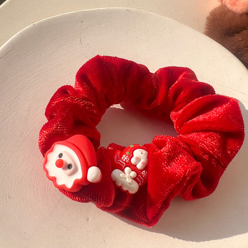 A luxurious Christmas Red Velvet Hair Tie, perfect for festive hairstyles, showcasing its rich red color and soft texture.