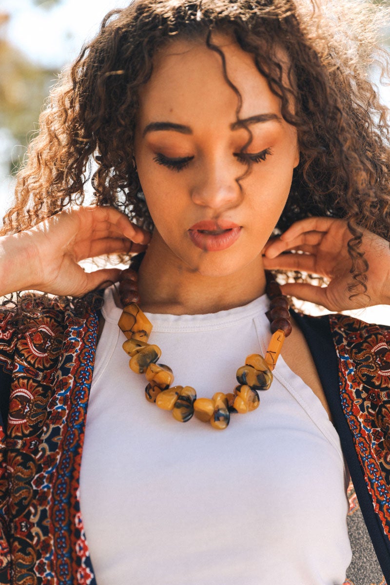 Chunky amber resin beaded necklace featuring vibrant, colorful beads, perfect for adding style to any outfit.