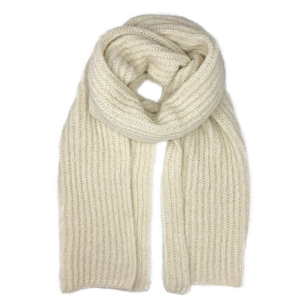 Chunky Snow Knit Alpaca Scarf in a soft white color, showcasing its oversized design and luxurious texture, perfect for cold weather layering.