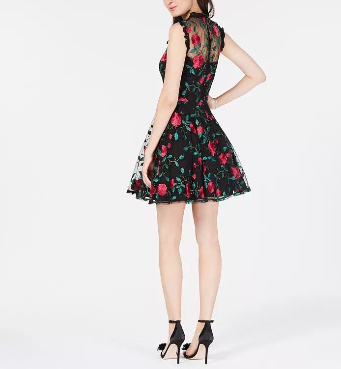 City Studios Juniors' Floral-Embroidered Illusion Dress featuring floral embroidery, scoop neckline, and ruffle trim.