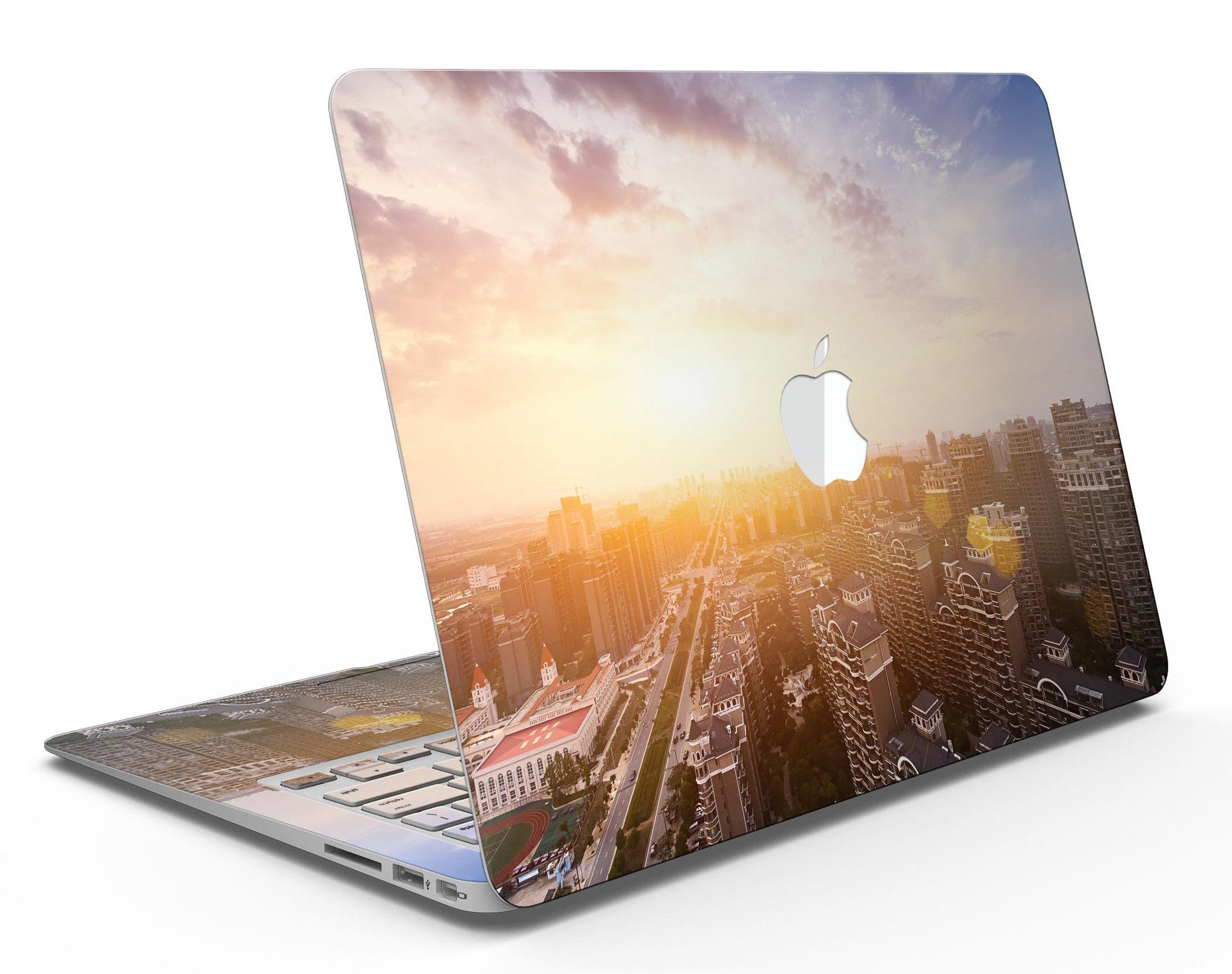 Cityscape at Sunset MacBook Air Skin Kit showcasing vibrant sunset colors and city skyline design.