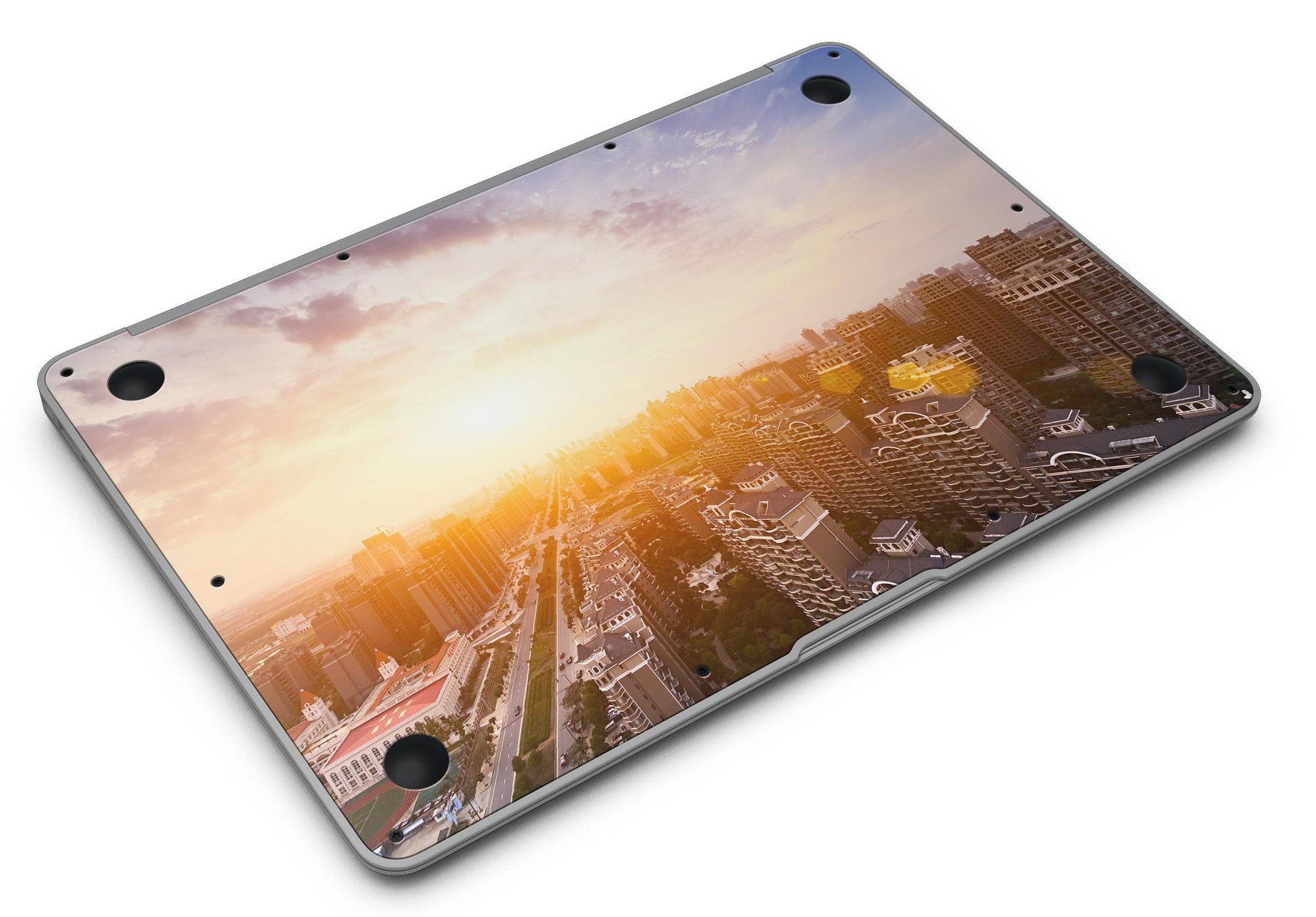 Cityscape at Sunset MacBook Air Skin Kit showcasing vibrant sunset colors and city skyline design.