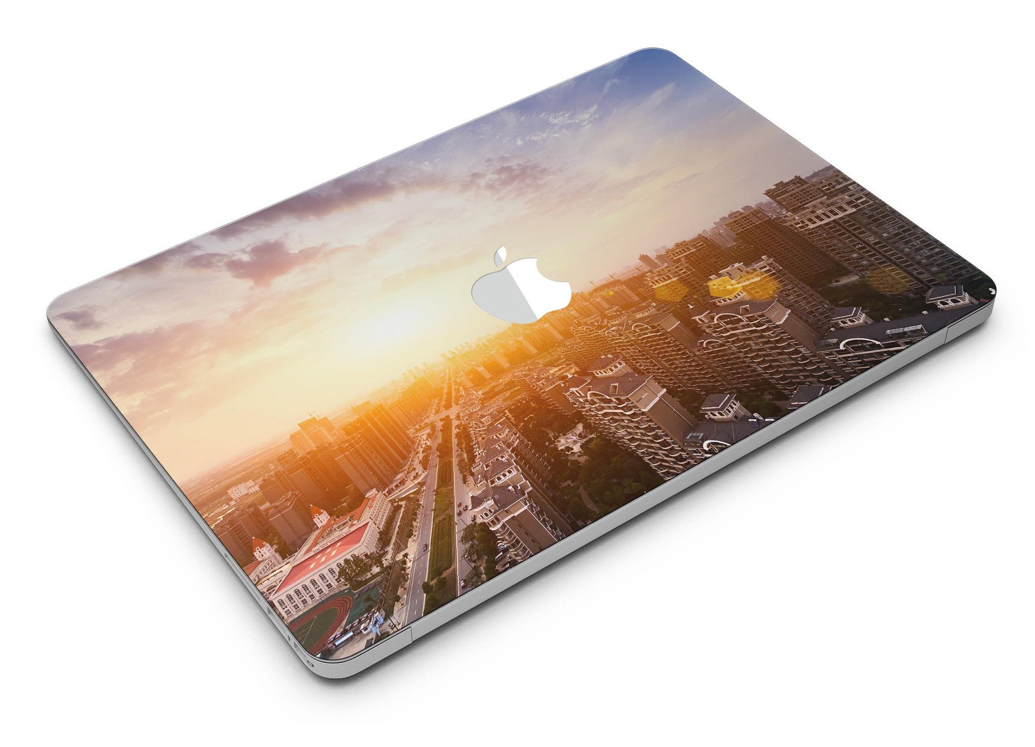 Cityscape at Sunset MacBook Air Skin Kit showcasing vibrant sunset colors and city skyline design.