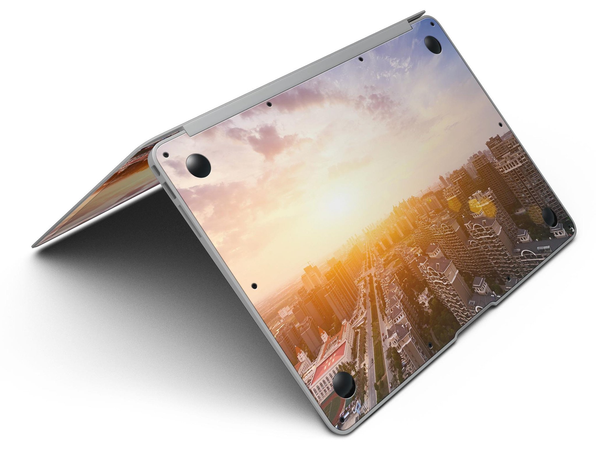 Cityscape at Sunset MacBook Air Skin Kit showcasing vibrant sunset colors and city skyline design.