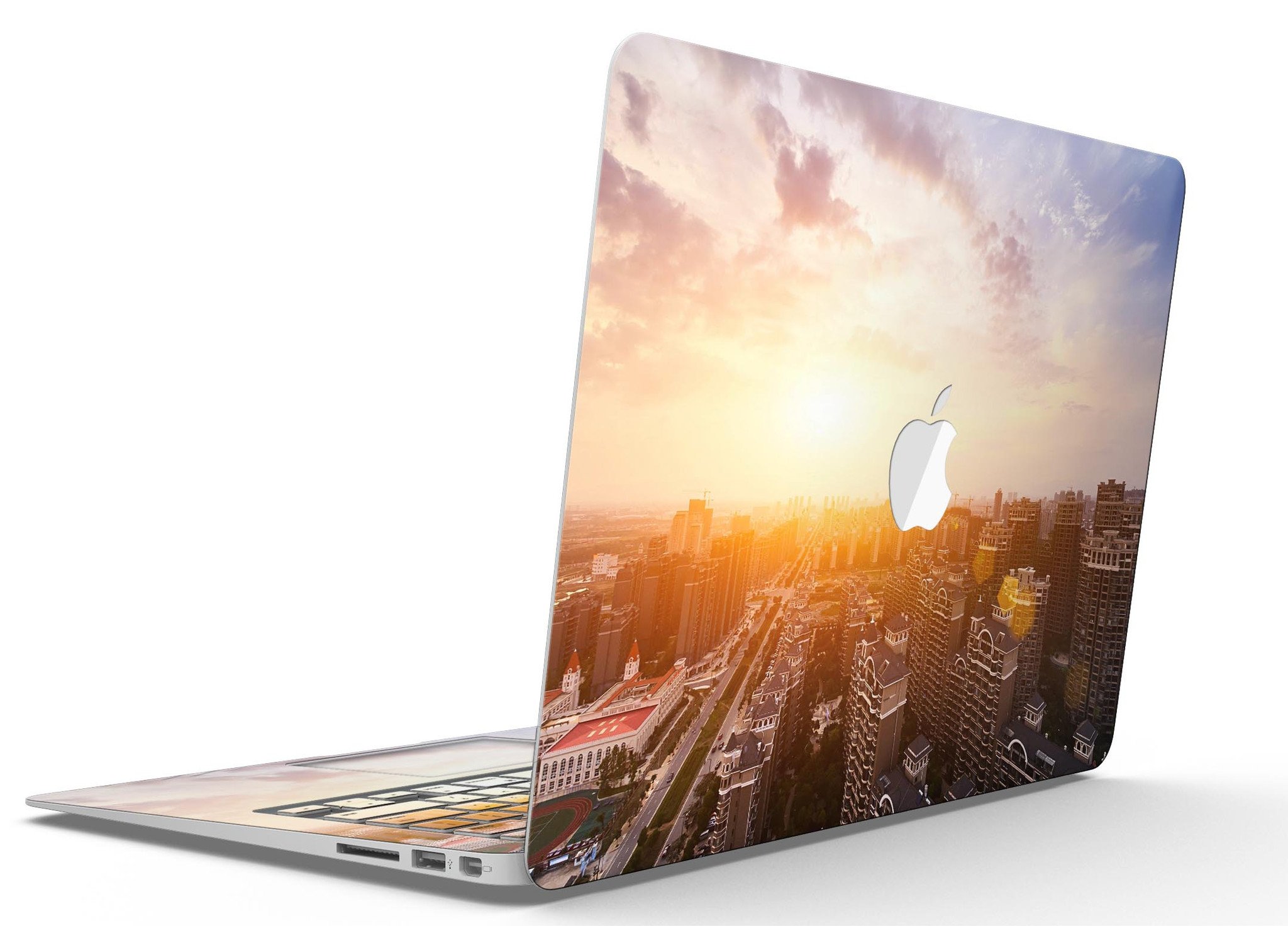 Cityscape at Sunset MacBook Air Skin Kit showcasing vibrant sunset colors and city skyline design.