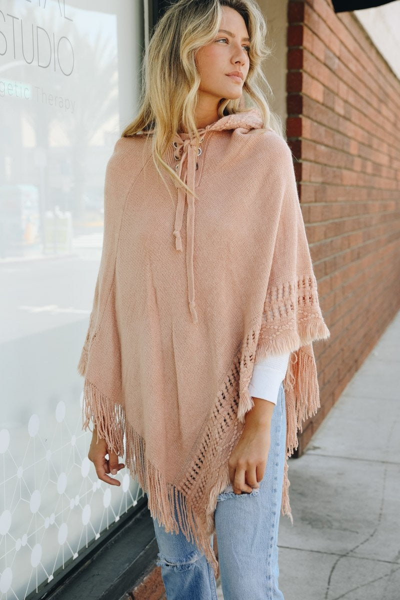 A stylish Classic Knit Hooded Poncho in a cozy knit fabric, featuring a hood and a loose fit, perfect for casual or dressy outfits.