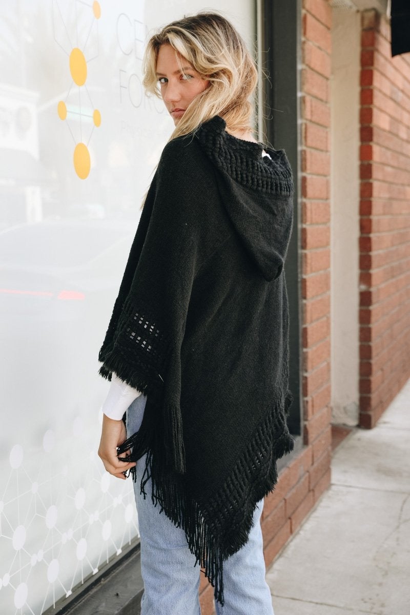 A stylish Classic Knit Hooded Poncho in a cozy knit fabric, featuring a hood and a loose fit, perfect for casual or dressy outfits.