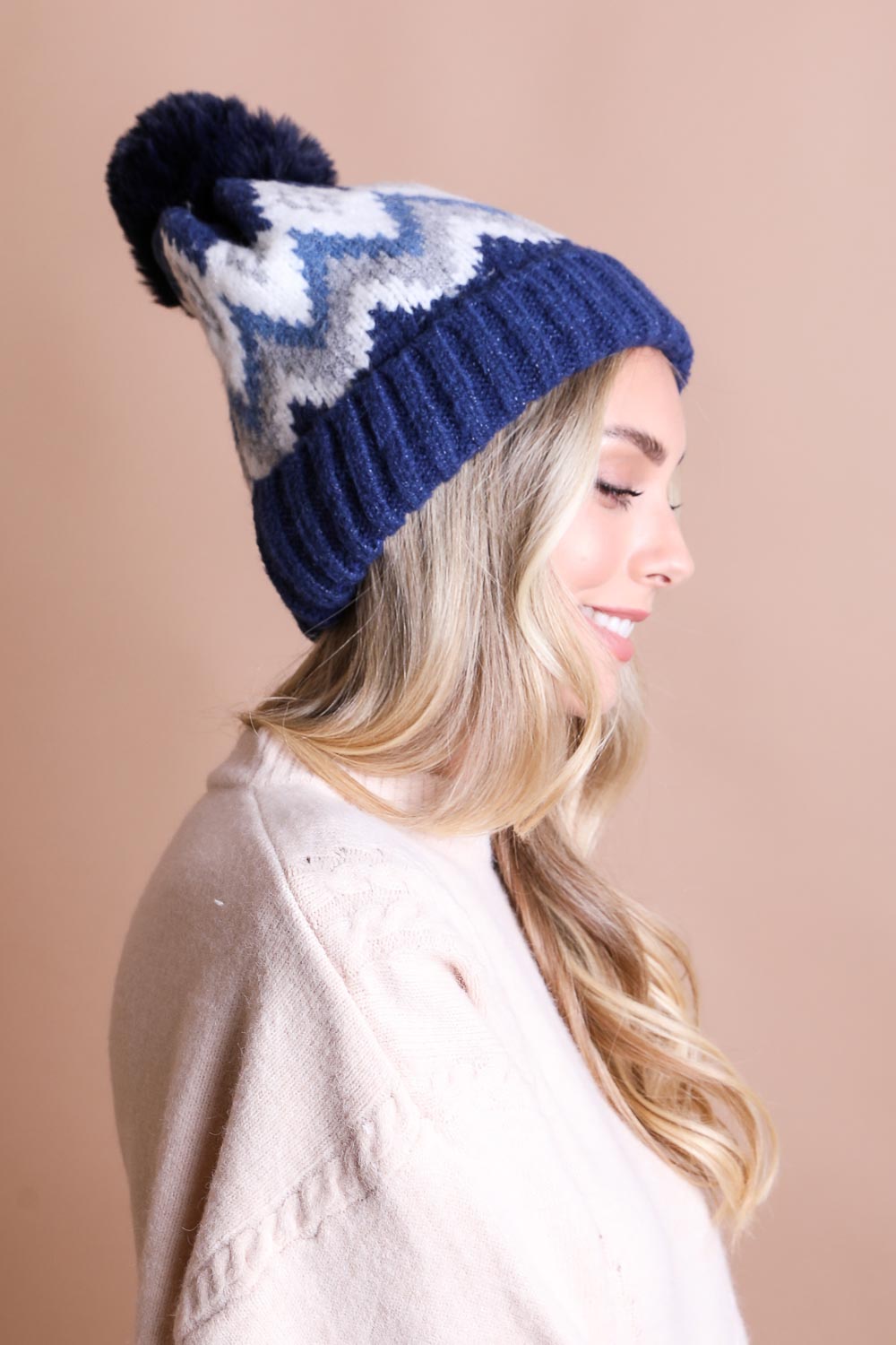 Classic Winter Pom Beanie with shaggy lining in vibrant colors, perfect for winter wear.