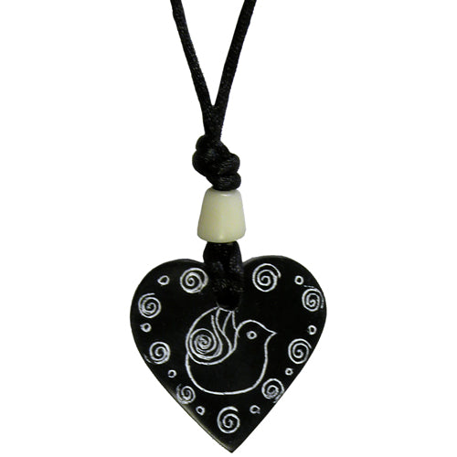 Handcrafted Coal Heart Pendant featuring a dove design, suspended on a black cord, symbolizing love and peace.