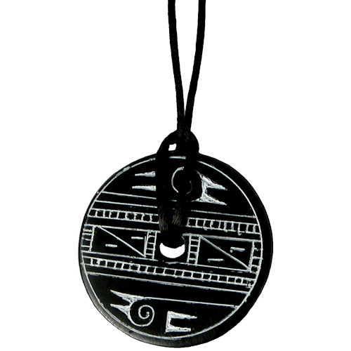 Handcrafted Coal Pendant featuring an abstract bird design, suspended on a black cord, symbolizing artisan craftsmanship and social responsibility.