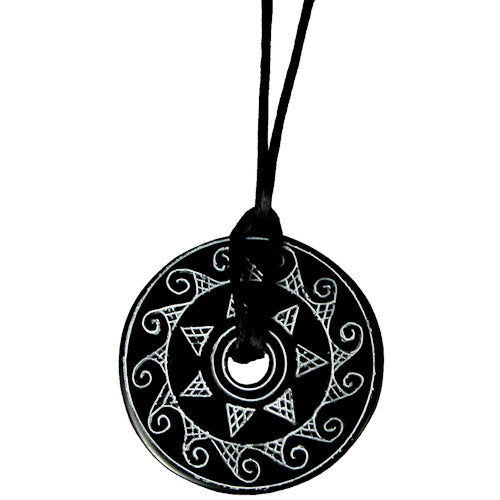 Hand-carved Coal Pendant featuring intricate sun etchings, suspended on a black cord, showcasing cultural artistry from Colombia.