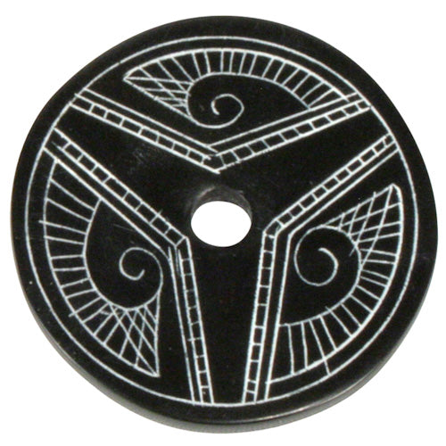 Black stone disc with patterns