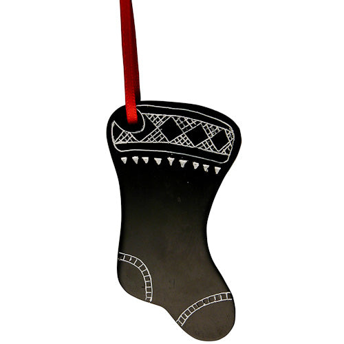 Handcrafted Coal Stocking Ornament with red ribbon, symbolizing fair trade and artisan craftsmanship from Colombia.