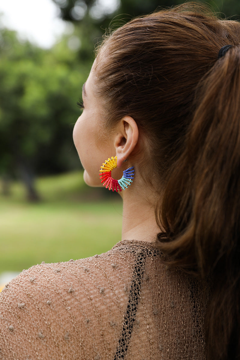 Colorful Beaded Hoop Earrings featuring a vibrant array of beads in a hoop design, perfect for adding flair to any outfit.