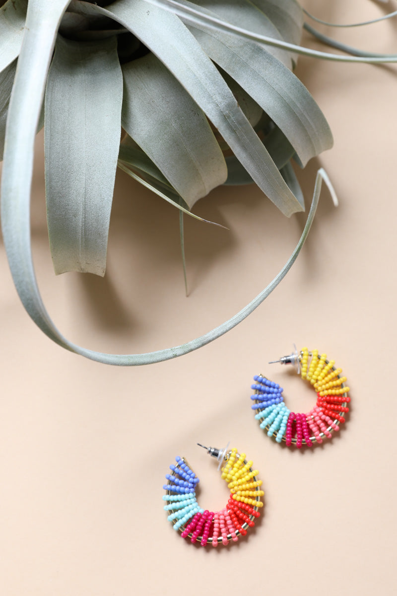 Colorful Beaded Hoop Earrings featuring a vibrant array of beads in a hoop design, perfect for adding flair to any outfit.