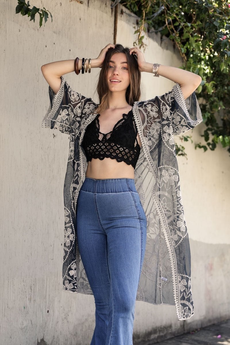 A lightweight embroidered kimono featuring contrast mesh and lace details, perfect for a boho-chic style in spring and summer.