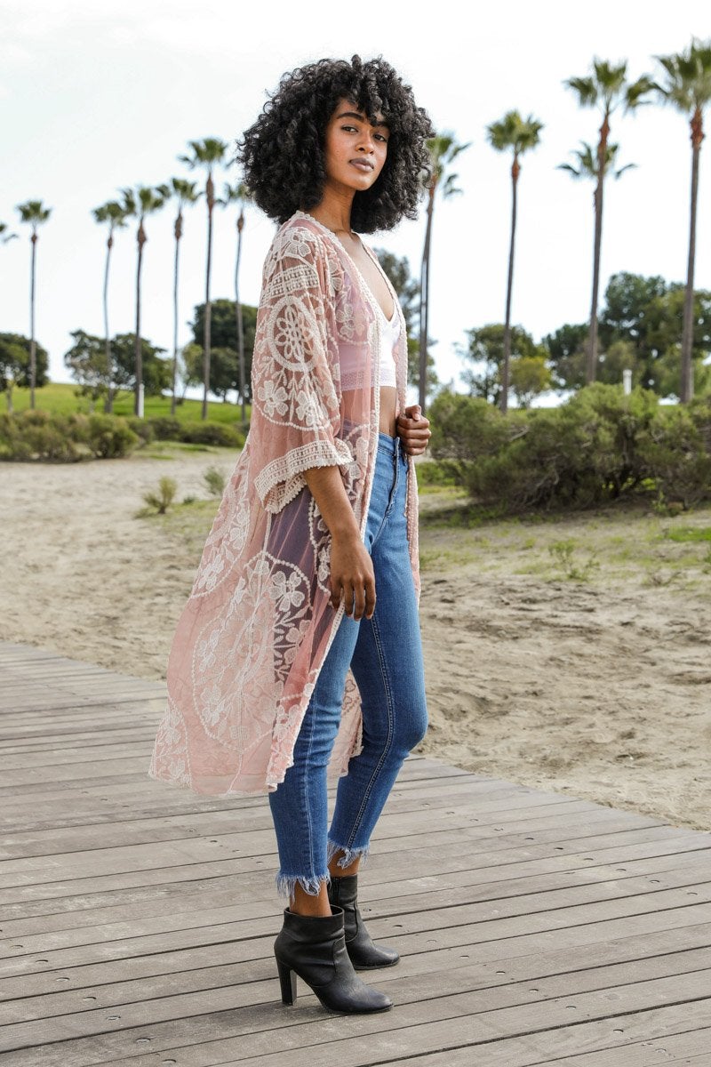 A lightweight embroidered kimono featuring contrast mesh and lace details, perfect for a boho-chic style in spring and summer.