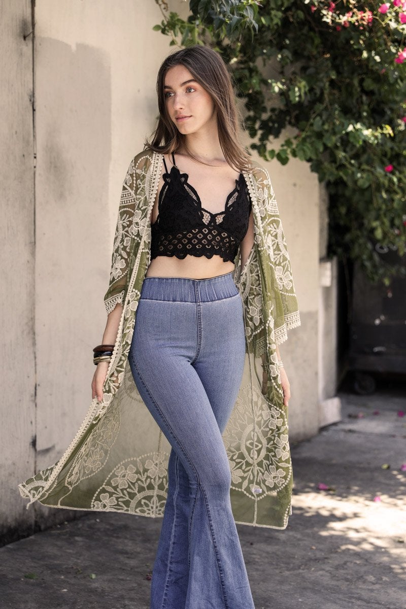 A lightweight embroidered kimono featuring contrast mesh and lace details, perfect for a boho-chic style in spring and summer.