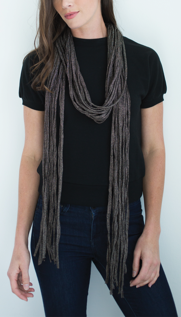 A stylish Copper Fiona wrap made from lightweight, recycled fabrics, showcasing its elegant design and 32-inch length.