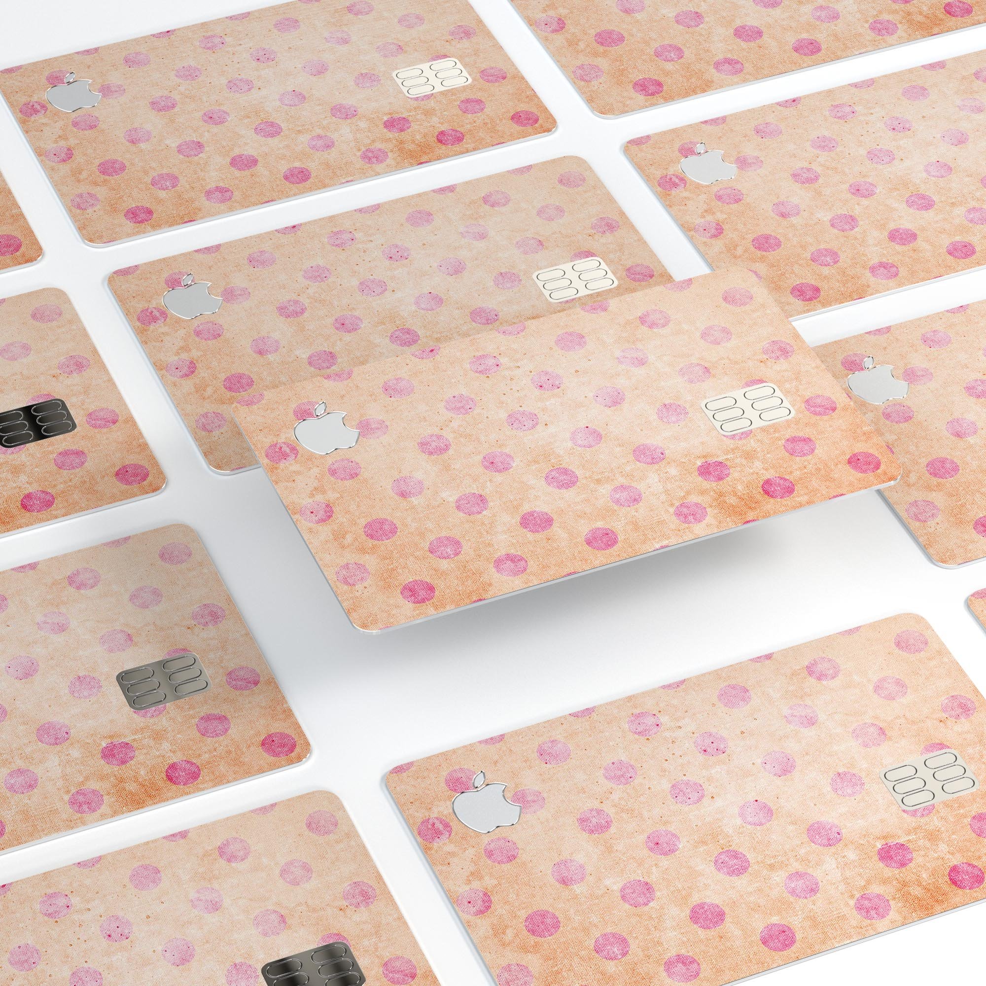 Coral and pink scratched polka dots protective decal for Apple Card, showcasing vibrant colors and stylish design.