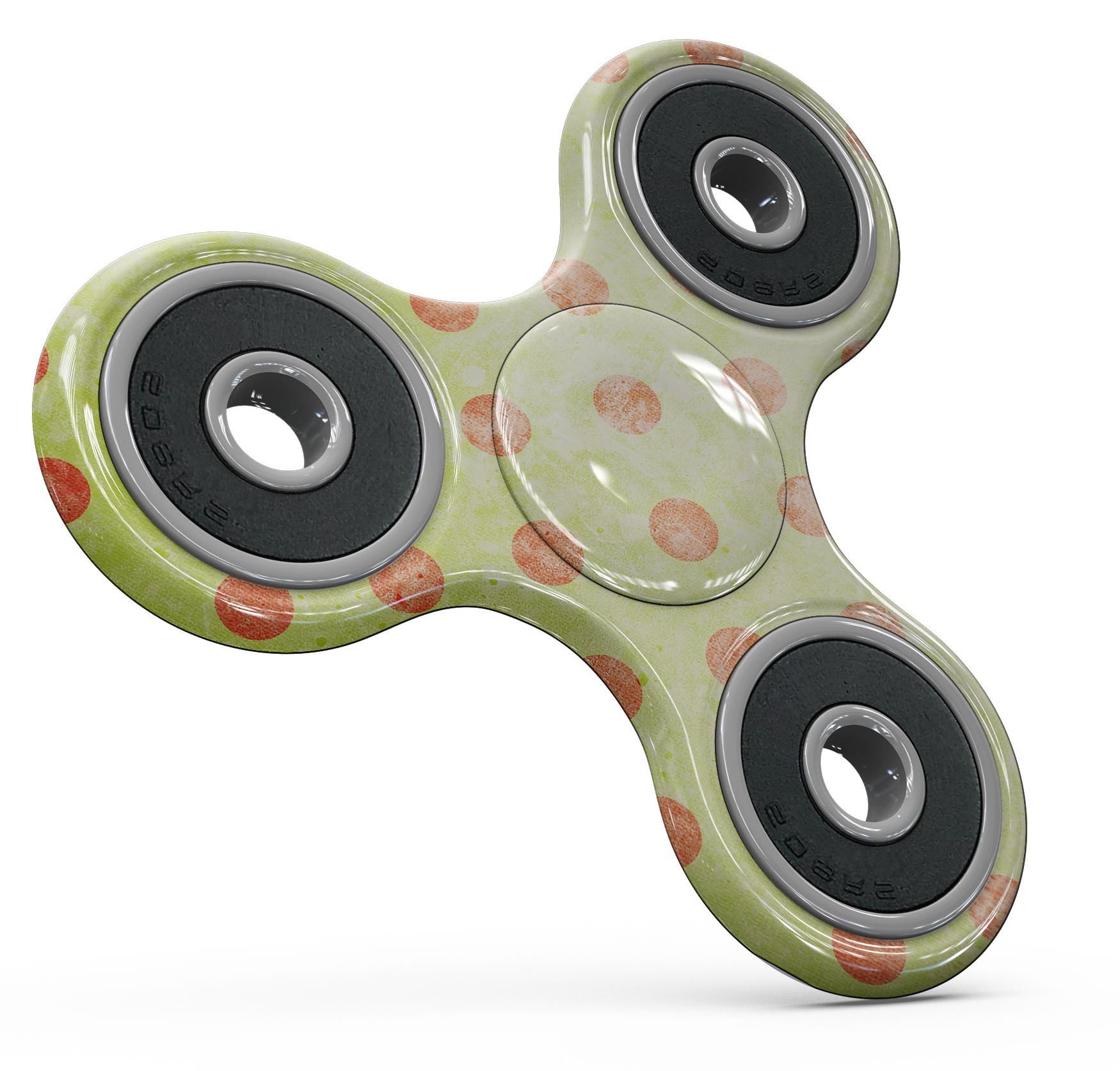 Coral polka dots design over a grunge yellow background on a fidget spinner skin kit, showcasing vibrant colors and a stylish pattern.