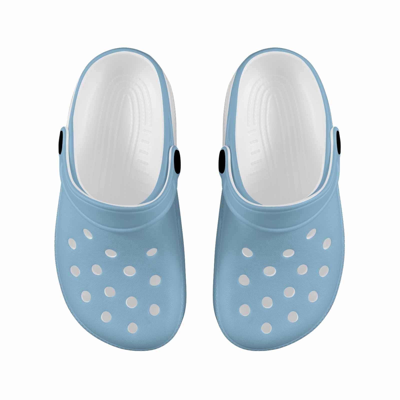 Cornflower blue clogs designed for youth, featuring a slip-on style, cushioned sole, and ventilation ports for breathability.