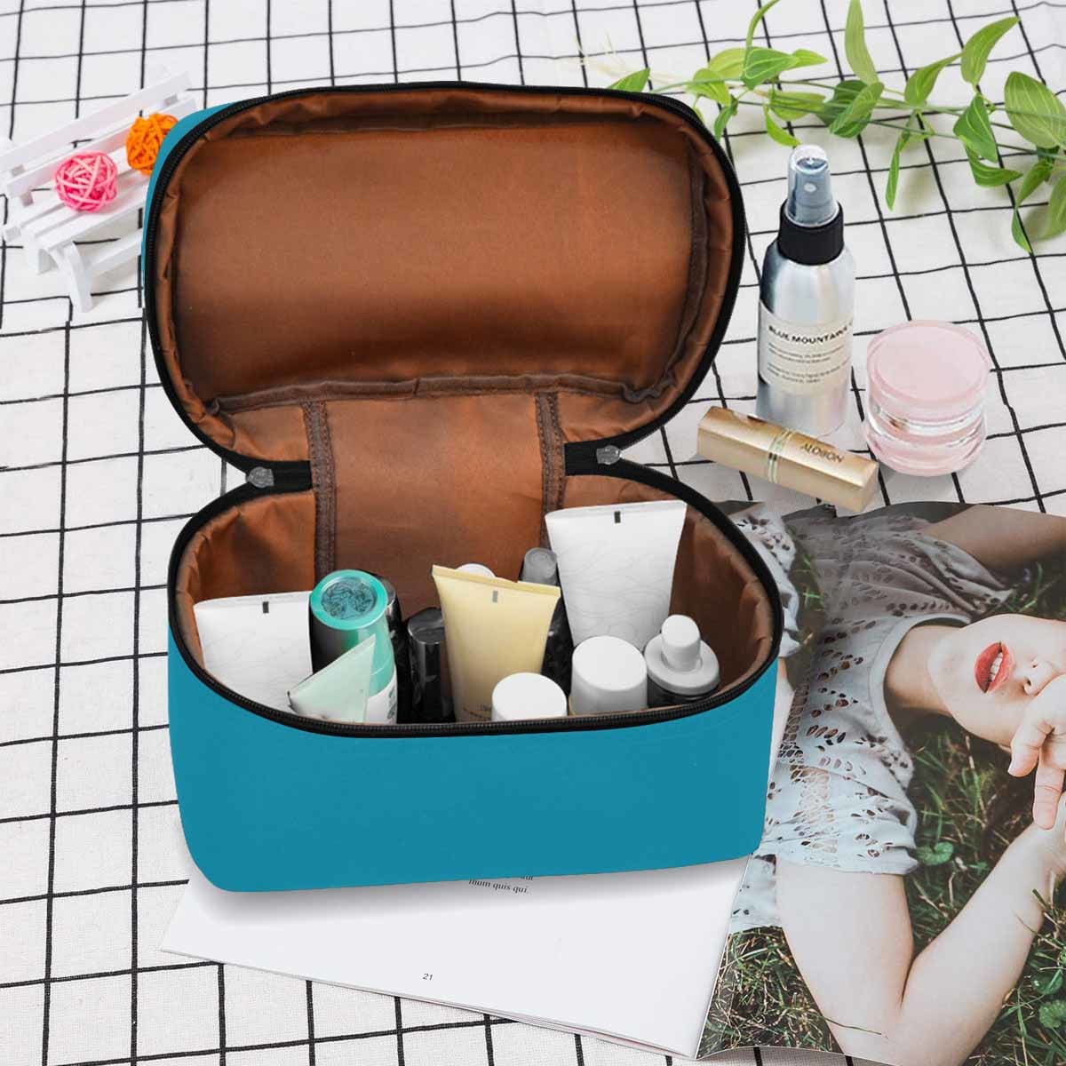 Stylish blue green cosmetic bag with multiple compartments and secure zipper closure, perfect for organizing beauty essentials.