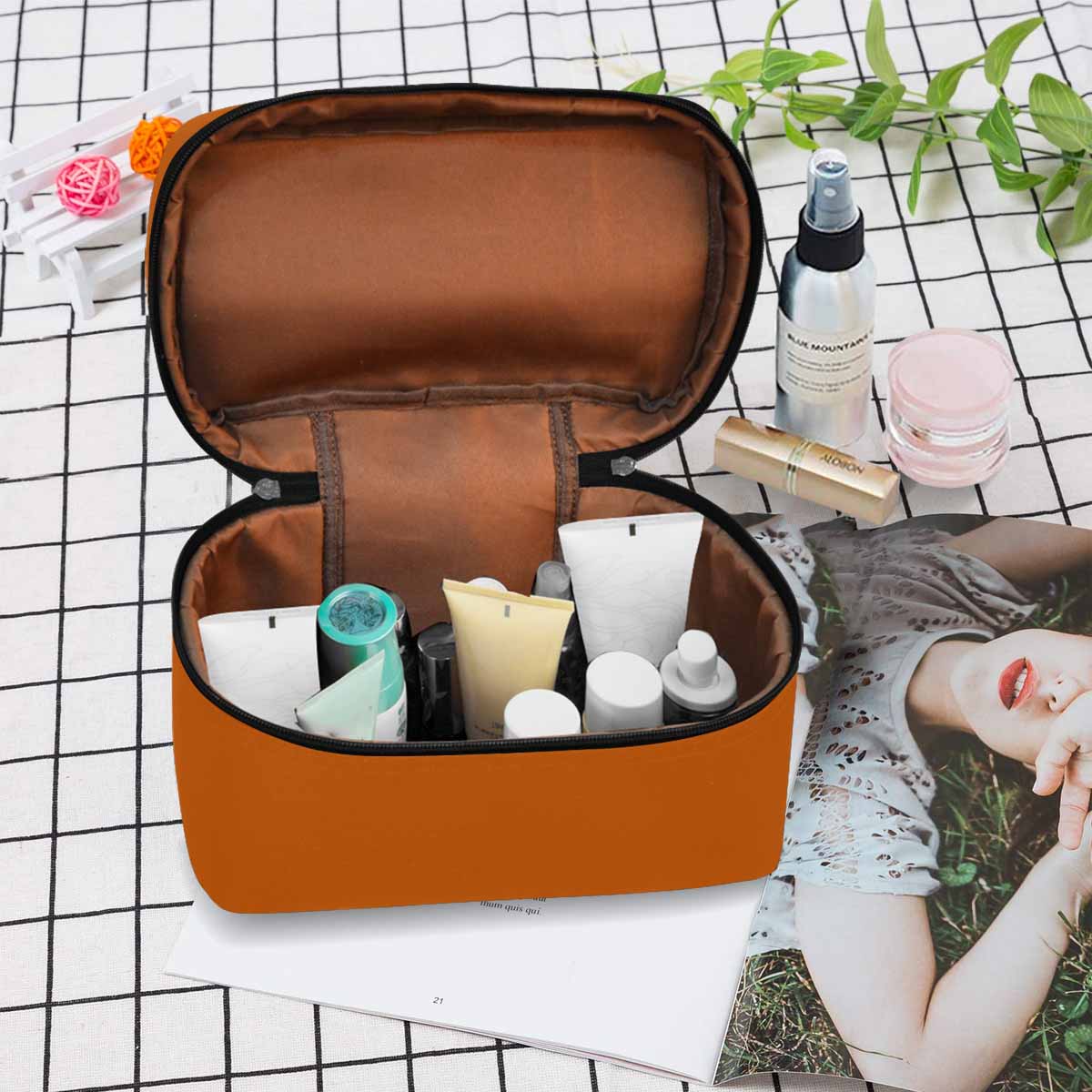 Burnt orange cosmetic bag with multiple compartments, stylish design, and secure zipper closure, perfect for travel and organization.