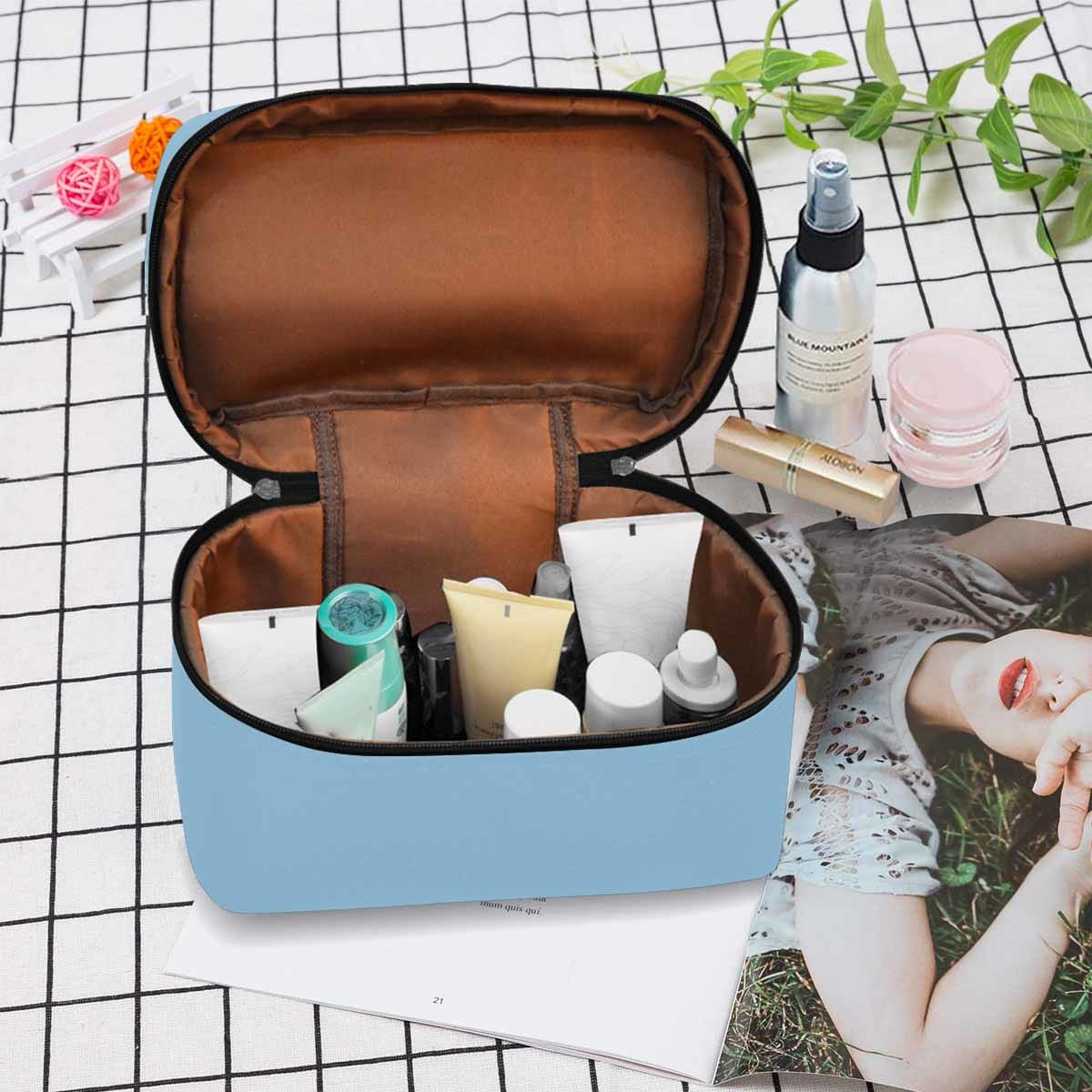 Cornflower Blue Cosmetic Bag with multiple compartments and secure zipper closure, perfect for organizing beauty essentials.