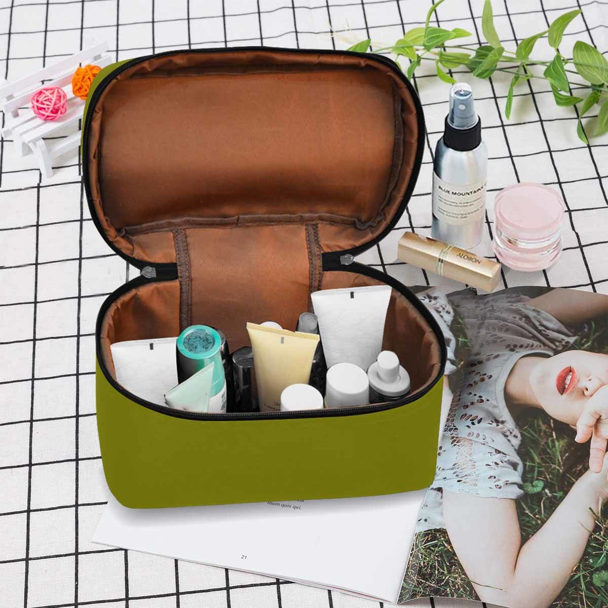 Dark olive green cosmetic bag with multiple compartments and zipper closure, perfect for organizing beauty essentials.