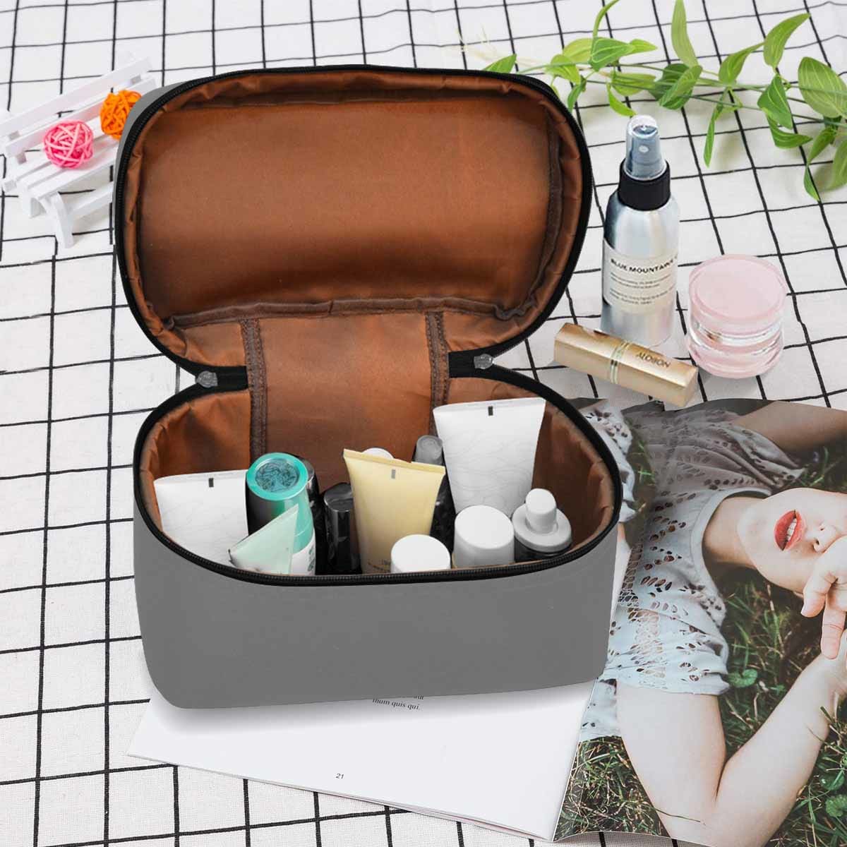 Gray cosmetic bag with multiple compartments, perfect for organizing beauty essentials.