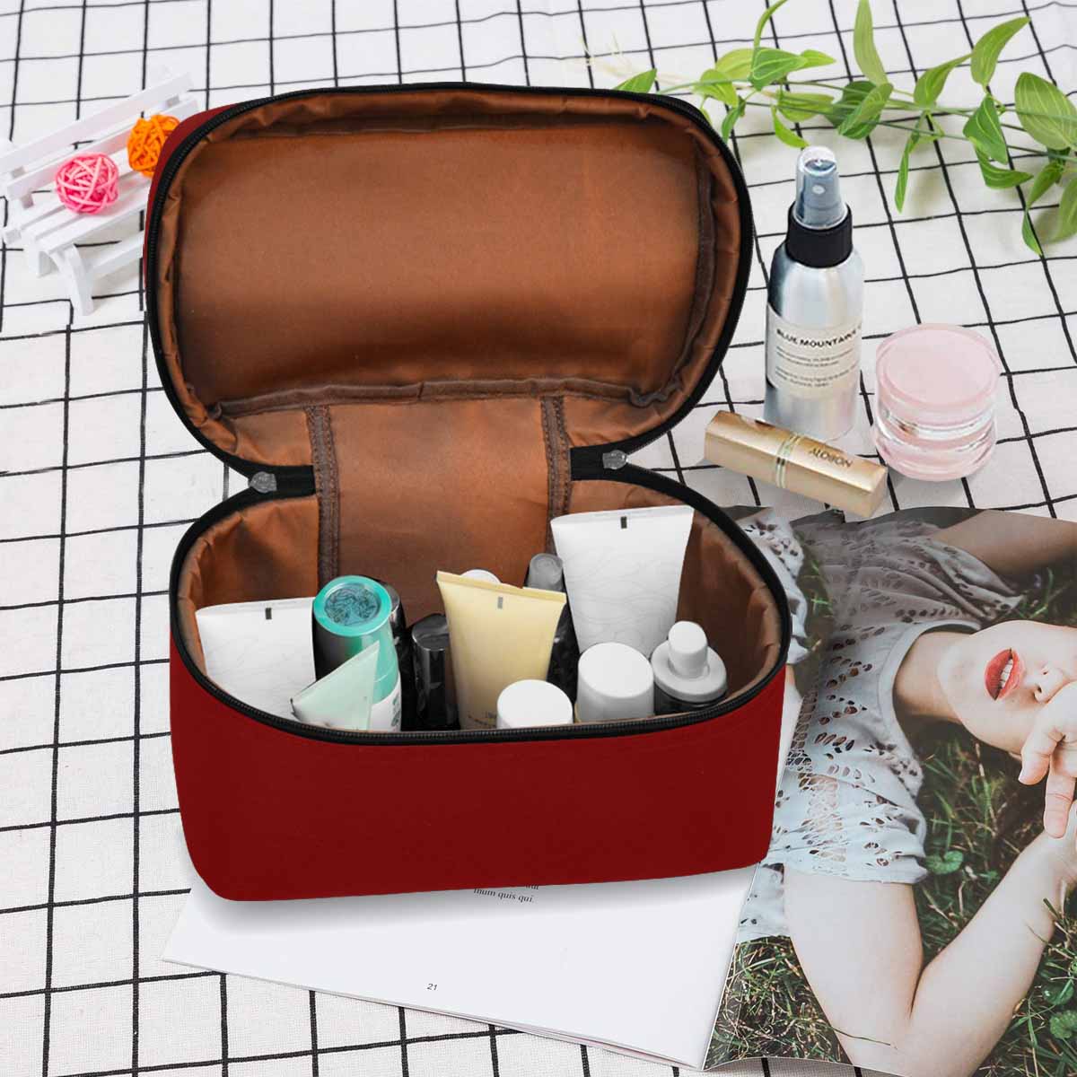 Maroon red cosmetic bag with multiple compartments and secure zipper closure, perfect for organizing beauty essentials.