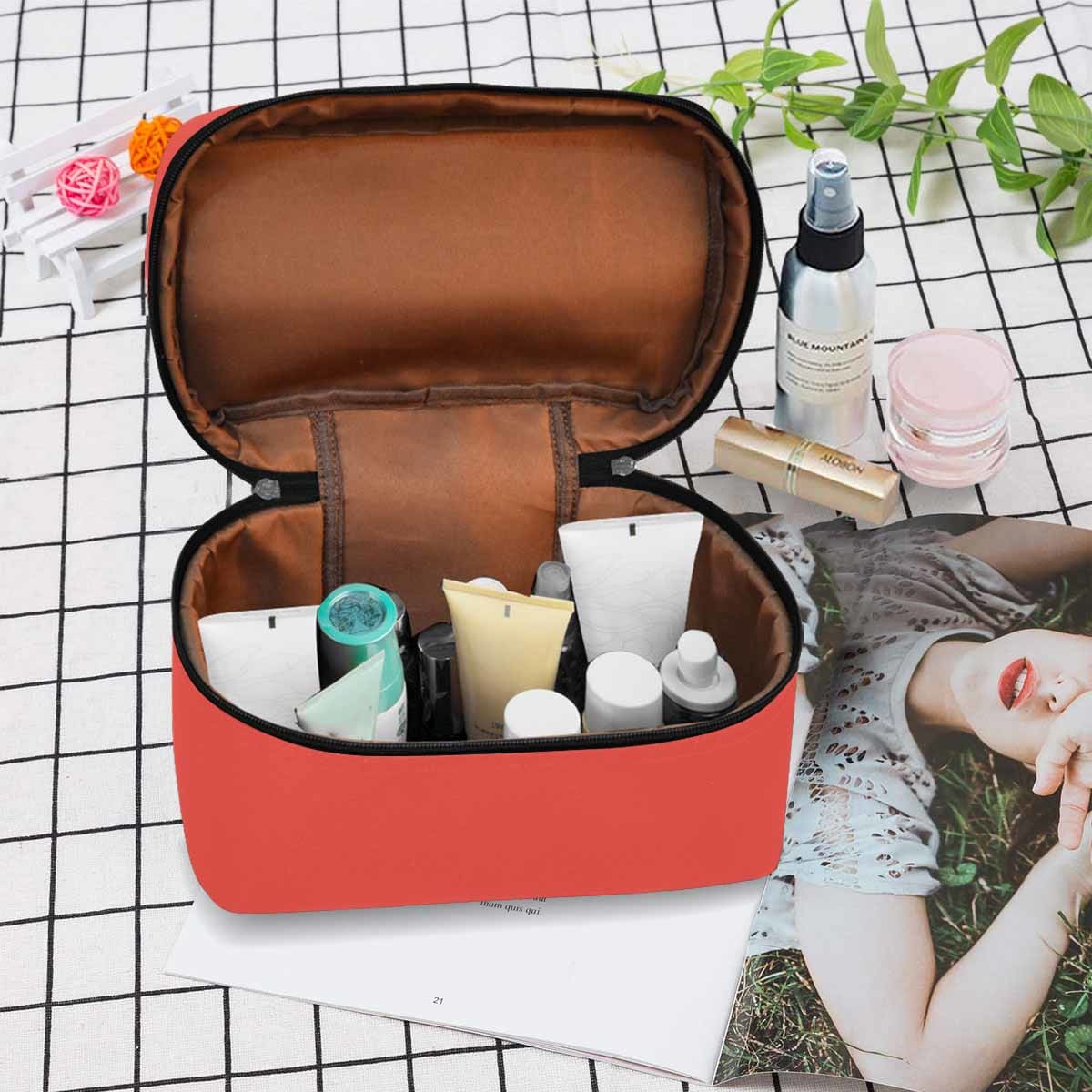 Stylish red orange cosmetic bag with multiple compartments and secure zipper closure, perfect for organizing beauty essentials.