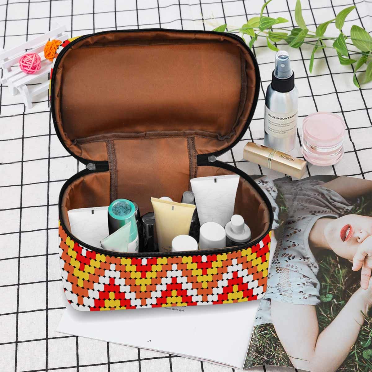 A stylish black and brown waterproof cosmetic bag with a zipper closure, ideal for travel and organizing beauty essentials.